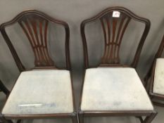 A set of four 19th century mahogany pierced splat back dining chairs