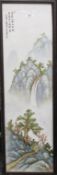 A Chinese porcelain plaque depicting a waterfall in a mountainous landscape,