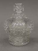 A 19th century cut glass scent bottle and stopper, formed as a crown,