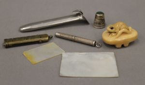 A small quantity of miscellaneous items, including a silver propelling pencil, a netsuke,