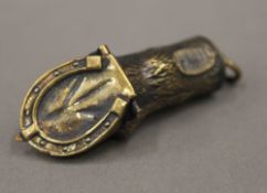 A brass vesta formed as a horses foreleg