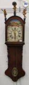 A 19th century Continental oak wall clock with painted dial and figural mounts