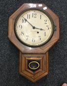 A Seth Thomas oak cased drop dial wall clock