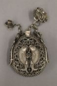 A silver pendant flask worked with a pair of fish