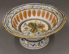 A large 19th century French polychrome decorated pottery footed bowl