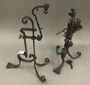 A pair of Arts and Crafts bronze rising table lamps,