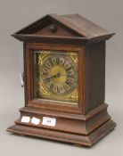 A 19th century oak cased German Junghans mantle clock, the signed movement striking on a gong,