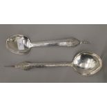 Two Eastern unmarked silver spoons, each handle decorated with Buddha (6.