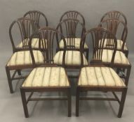 A set of eight late 19th/early 20th century mahogany shield back dining chairs