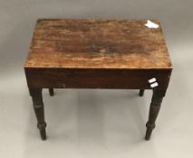 A 19th century mahogany bidet with ceramic basin and ring turned legs