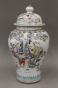 A Chinese porcelain lidded vase decorated with various figures