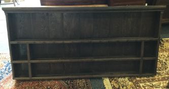 A Georgian oak dresser rack