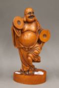 A carved wooden figure of Buddha