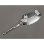 A Webster & Co Sterling silver hand mirror. 33 cm long.