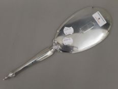 A Webster & Co Sterling silver hand mirror. 33 cm long.