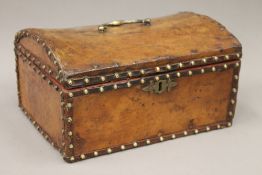 A 19th century leather clad domed casket,