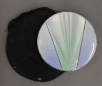 An Art Deco silver and enamel compact