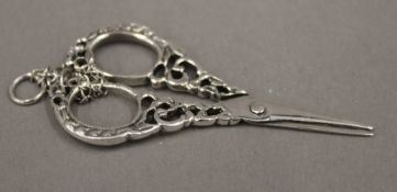 A pair of miniature silver scissors