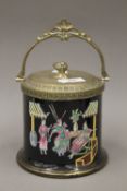 A Victorian biscuit barrel with enamelled chinoiserie decoration