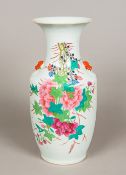 A Chinese porcelain vase, decorated with floral sprays opposing calligraphic text. 43 cm high.