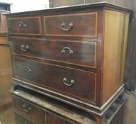 An Edwardian mahogany chest of two short over two long chest of drawers, on splayed bracket feet,