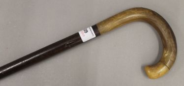 A 19th century walking stick with curved horn handle