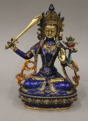 A colourfully decorated model of Buddha