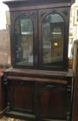 A 19th century mahogany bookcase cabinet, the upper section glazed,