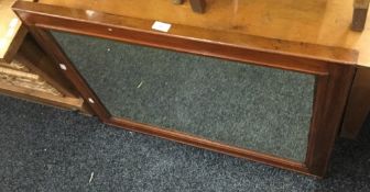 A Victorian walnut framed bevel glazed mirror