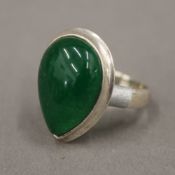 A silver and jade set ring