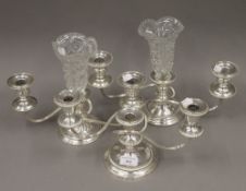 Three silver plated on copper candelabra