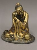 A gilt bronze figure of a deity