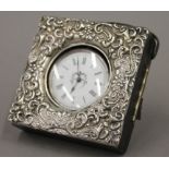 An Edwardian silver mounted leather pocket watch case and silver cased watch