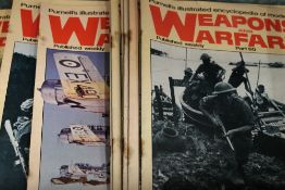 A suitcase full of Weapons and Warfare Weekly Magazines