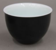 A small Chinese black ground tea bowl