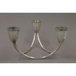 A Sterling silver three branch table candelabra of vintage design