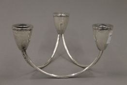 A Sterling silver three branch table candelabra of vintage design