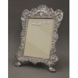 An ornate Victorian silver on copper photo frame