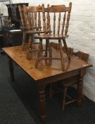 A modern pine kitchen table and four chairs