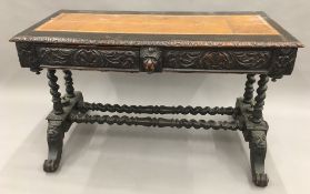 A Victorian carved oak writing table,