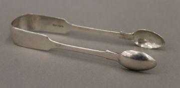 A pair of Victorian silver sugar tongs, hallmarked London 1874,