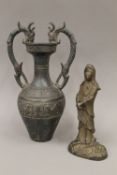 A twin handled Chinese patinated metal vase with archaic 'bird' designs to body;