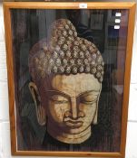 An Eastern batik on cloth, Buddha's head,