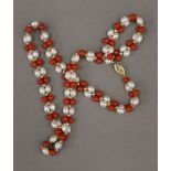 A 14 ct yellow gold pearl and coral set necklace,