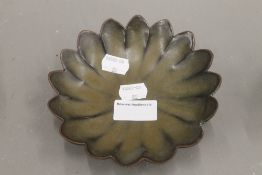 A Chinese porcelain dish, lappet moulded.