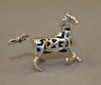 A silver pin cushion modelled as a horse