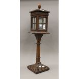 An oak table light modelled as a streetlamp with leaded glazing. 71.5 cm high.