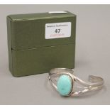 A turquoise set silver bangle bracelet,