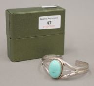 A turquoise set silver bangle bracelet,