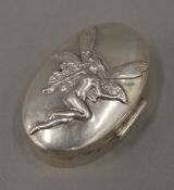 A small hallmarked silver box, the lid embossed with a fairy (26.